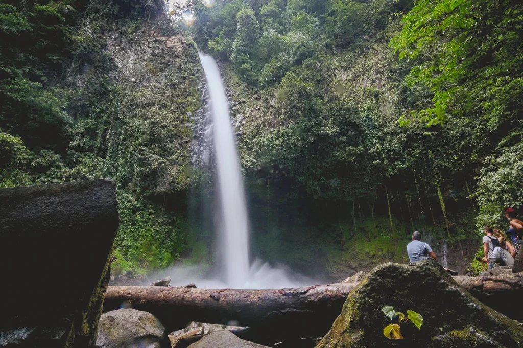 La fortuna waterfall with people Costa Rica